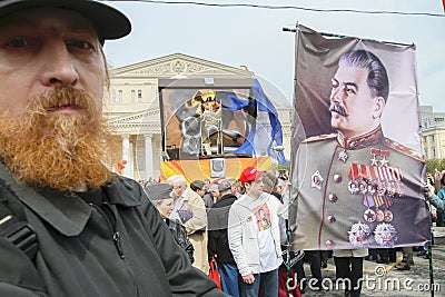 Russia May Day.Communist party supporters take part in a rally. (portrait of Soviet dictator Josef Stalin) Editorial Stock Photo