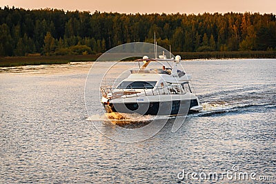 Russia, Moscow August 2018: small high-speed boat sails on the river channel Editorial Stock Photo