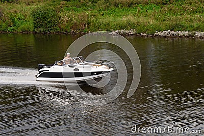 Russia, Moscow August 2018. Small high-speed boat sails on the river channel of Moscow Editorial Stock Photo