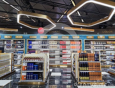 Modern interior of Duty Free zone with a large selection of quality alcohol in Vnukovo Airport, Moscow. Editorial Stock Photo