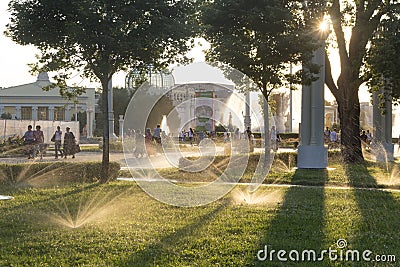 Russia, Moscow, VDNH Park. Evening watering of the garden. Editorial Stock Photo