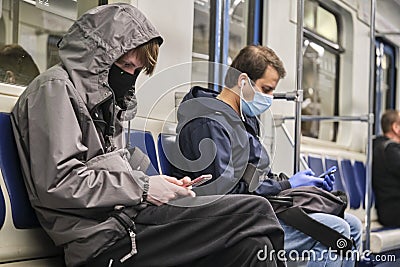 Russia Moscow June 2020. Moscow metro. people in protective masks ride in a subway car. coronavirus epidemic in Russia. viral risk Editorial Stock Photo