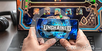 Russia Moscow 30.05.2021.Logo, screenshot of blockchain nft ethereum cryptocurrency game Unchained gods in laptop.mobile phone. Editorial Stock Photo