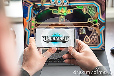 Russia Moscow 30.05.2021.Logo, screenshot of blockchain nft ethereum cryptocurrency game Unchained gods in laptop.mobile phone. Editorial Stock Photo