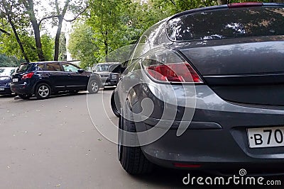 Russia, Moscow - May 04, 2019: Gray metallic Opel Astra modified to Stance style. Car with big custom steel wheels parked on the Editorial Stock Photo