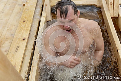 Russia, Moscow, 01.19.2019. Swimming in the ice-hole in winter on the feast of Epiphany Editorial Stock Photo