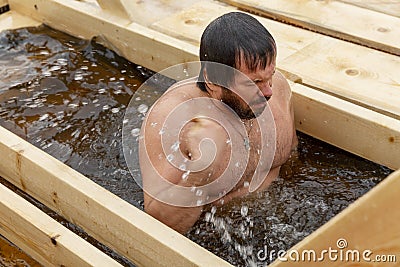 Russia, Moscow, 01.19.2019. Swimming in the ice-hole in winter on the feast of Epiphany Editorial Stock Photo