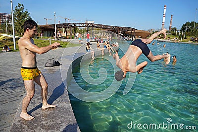 Rest and jumps at the city pool in Moscow Editorial Stock Photo