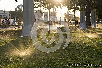 Russia, Moscow, VDNH Park. Evening watering of the garden. Editorial Stock Photo