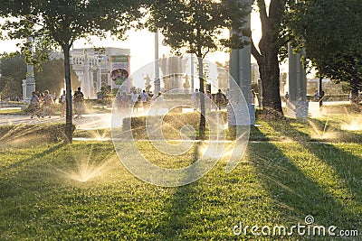 Russia, Moscow, VDNH Park. Evening watering of the garden. Editorial Stock Photo