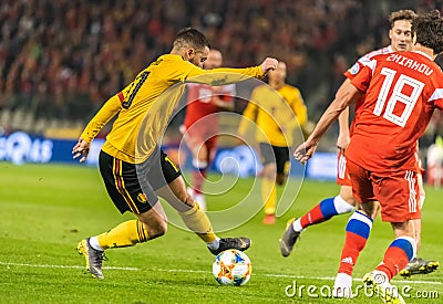 Russia national team defender Yury Zhirkov committing a foul on Belgium national football team captain Eden Hazard Editorial Stock Photo