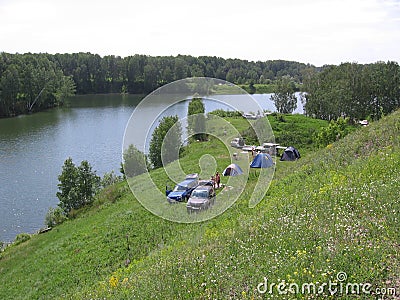 camping in a park for cars parking in a tourist camp on the shore people relax Editorial Stock Photo