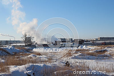 Russia, Novosibirsk: industrial zone on a vacant lot covered with snow in winter Editorial Stock Photo