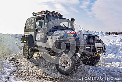 Offroad SUV `Jeep Wrangler` 4x4 with off-road training rides in winter on snow Editorial Stock Photo