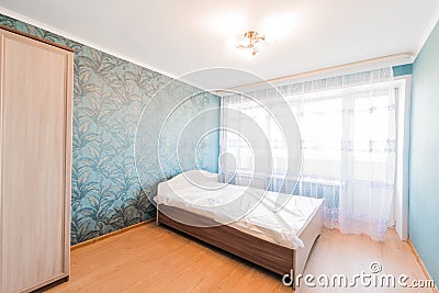 Russia, Omsk- August 02, 2019: interior room apartment. standard repair decoration in hostel. bedroom with bed Editorial Stock Photo