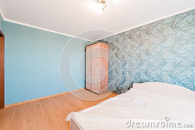 Russia, Omsk- August 02, 2019: interior room apartment. standard repair decoration in hostel. bedroom with bed Editorial Stock Photo