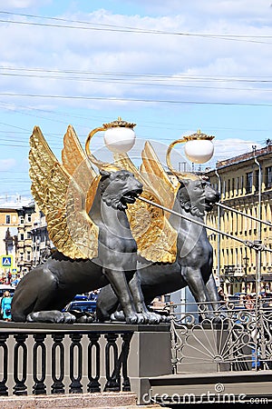 Russia, Petersburg, June 29, 2019. Winged lions on the Bank Bridge. Griffins on the Bank Bridge on the Fontanka River, according Editorial Stock Photo