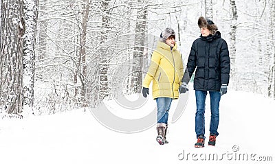 Russia, Ryazan 04 Jan 2017: husband hugs and walking with pregnant wife in winter forest Editorial Stock Photo