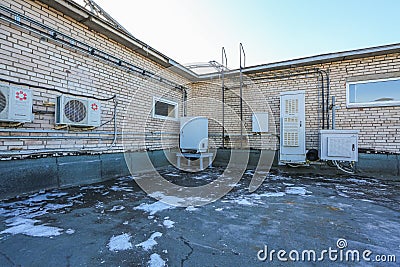 Russia, Saint-Petersburg - April 30, 2018: Climatic vandal-proof cabinet with microwave equipment and power cables, coaxial cables Editorial Stock Photo
