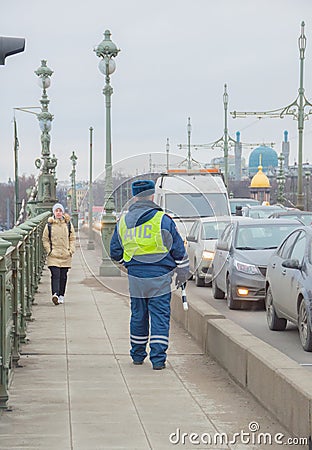 Russia, Saint-Petersburg, 16 February 2017 - the bridge is a traffic police officer Editorial Stock Photo