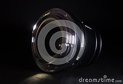 RUSSIA, SAINT PETERSBURG - JANUARY 21, 2023: Camera lens on black background Editorial Stock Photo