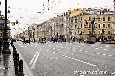10/21/2019 Russia. Saint Petersburg. Nevsky Avenue. People cross the road on a cloudy autumn day Editorial Stock Photo