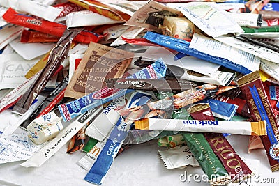 RUSSIA, SAINT-PETERSBURG - OCTOBER 20, 2016. Many sugar sachets of cafes and restaurants from different countries. Editorial Stock Photo