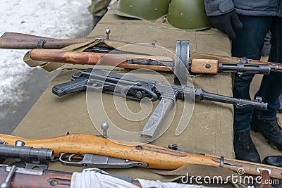 03/01/2020 Russia. Saint Petersburg. Weapons, machine guns lying on the table. Stock Photo