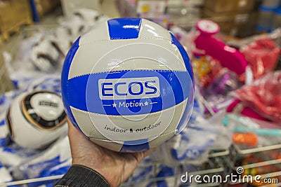 a man's hand holds a ball in his hands in a large store Editorial Stock Photo