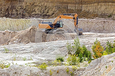 a large kaolin quarry near the city of Kyshtym, Chelyabinsk region. loading the Kamaz truck with an excavator Editorial Stock Photo