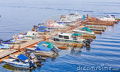 Parking of motor boats and boats on the Volga River Editorial Stock Photo