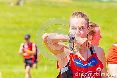 Portrait of dirty beautiful girls participating in the race of heroes to overcome difficult obstacles on a summer sunny day. text Editorial Stock Photo