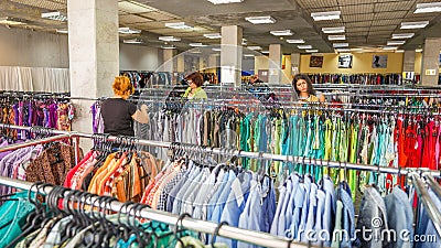 Russia, Samara, June 2016: Women choose clothes for purchase in the store Editorial Stock Photo