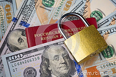 Russia Sanctions and Ukraine war concept. Russian Federation passport, padlock on american dollars. Currency ban in Russia Stock Photo