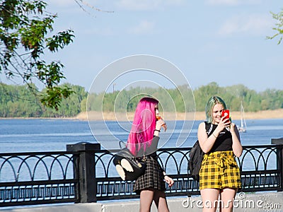 Russia Saratov region Engels may 9, 2019:bright teenage girls with pink hair on the street Editorial Stock Photo
