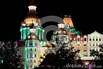 Russia, Sochi, April 14, 2021: Olympic Village. The illuminated castle is a hotel in an amusement park. Night shooting Editorial Stock Photo