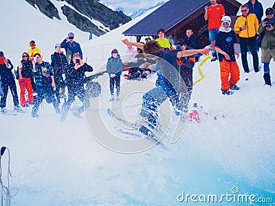 Russia, Sochi 11.05.2019. A young guy in a mask and on skis jumps out of the pool with water makes a cool feint Editorial Stock Photo