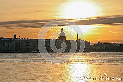 Russia, St. Petersburg, early morning on the Neva River, bright golden sunrise with a view of St. Isaac`s Cathedral. A warm, sensu Editorial Stock Photo