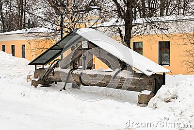 Russia, St. Petersburg, January 2022. An old wooden beam holding the bells of the cathedral, as a museum exhibit. Editorial Stock Photo