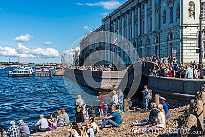 Russia, St. Petersburg, July 2020. People on a small beach near the Hermitage in the city center. Editorial Stock Photo