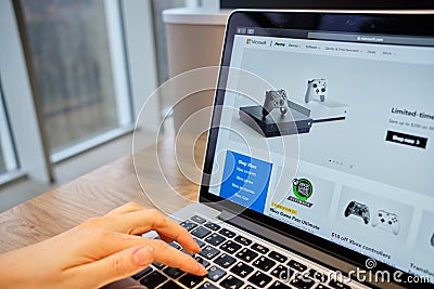 RUSSIA, ST.PETERSBURG - March 5: A girl browses the Microsoft section of the console xbox on a laptop Editorial Stock Photo