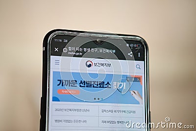 RUSSIA, ST.PETERSBURG - March 03, 2020: Government health South Korea website on smartphone display on blurred background Editorial Stock Photo