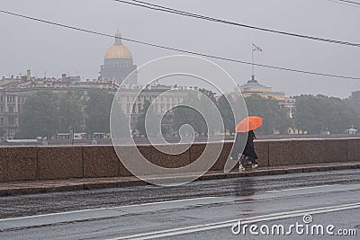Russia, St. Petersburg in the summer in the rain. A rainy gray cloudy city. View of the sights. The dome of St. Isaac`s Cathedral. Editorial Stock Photo
