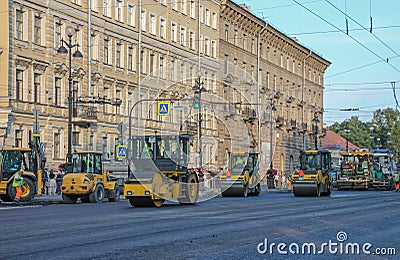 Russia, St. Petersburg, summer street, road repair, yellow asphalt rollers, cars for road repair, asphalt laying Editorial Stock Photo