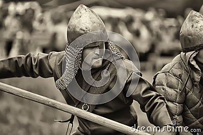 Russia, Staraya Ladoga 23,06,2012 Reenactors with shields and spears during the battle, Festival of Historical Reconstruction of Editorial Stock Photo