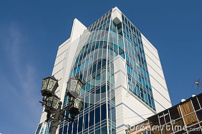 22.03.2017. Russia, Sverdlovsk Region, city of Yekaterinburg, a fragment of the building facade against the blue sky. Modern busin Editorial Stock Photo