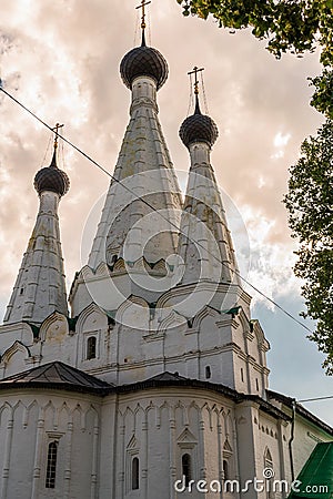 Russia, Uglich, July 2020. A dark thundercloud over the white three-domed Orthodox Church. Editorial Stock Photo