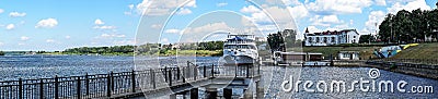 Russia. Uglich, July 2020. River motor ship at the pier against the background of the coast. Editorial Stock Photo