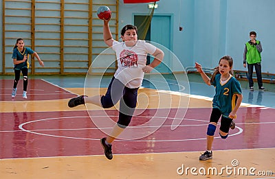 Kids play handball indoor. Sports and physical activity. Training and sports for children Editorial Stock Photo