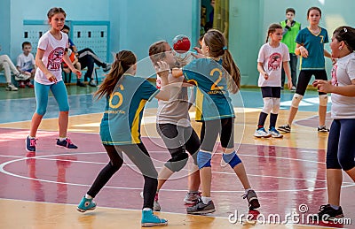 Kids play handball indoor. Sports and physical activity. Training and sports for children Editorial Stock Photo